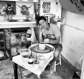 Kris at the pottery wheel in her studio
